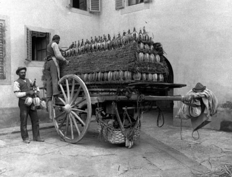 Straw wrapped fiaschi loaded ready for transport Straw wrapped fiaschi loaded ready for transport