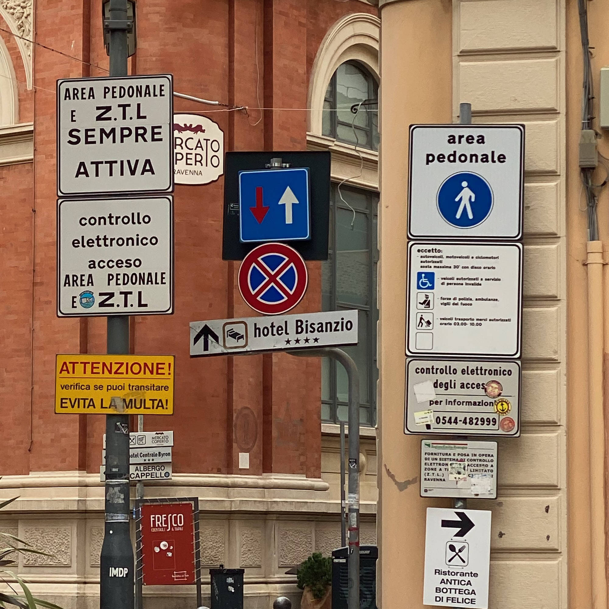 You can come across a plethora of road signs when approaching town centres. There is no 'no-entry' sign here, but the blue 'zona pedonale' means that this is a car-free pedestrian zone. ZTL-plethora-signs